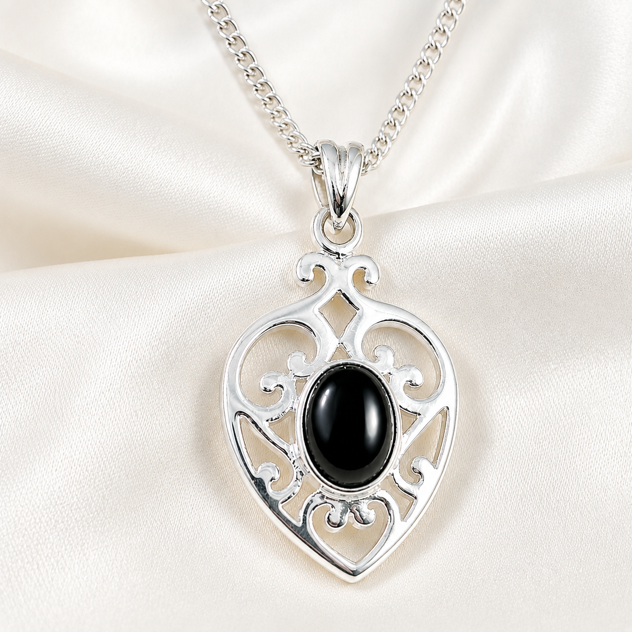 Scrolled silver heart
