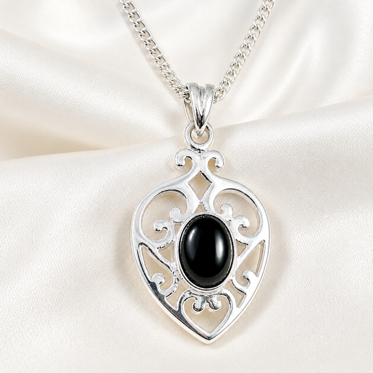 Silver scrolled heart