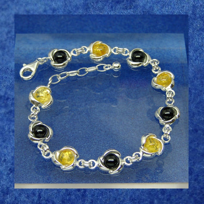 10 stone Sterling silver bracelet inset with Whitby jet and poppy lemon amber